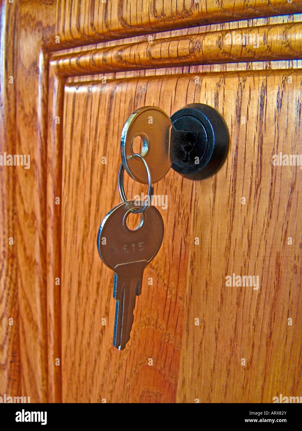Key in desk lock Stock Photo Alamy