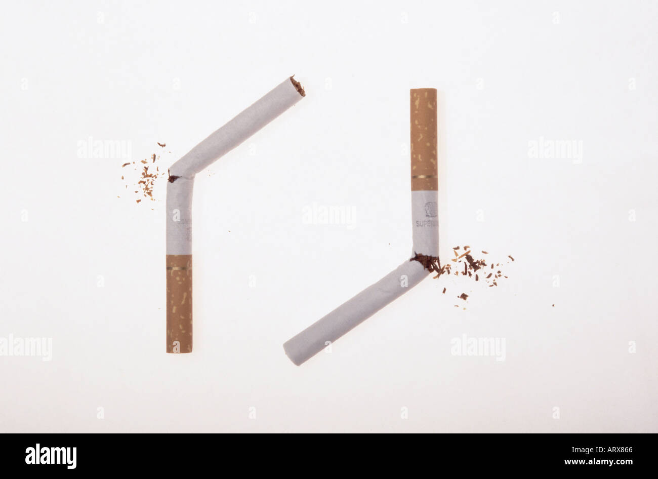 Cigarette stop smoking concept break the habit or snap out of it Stock Photo