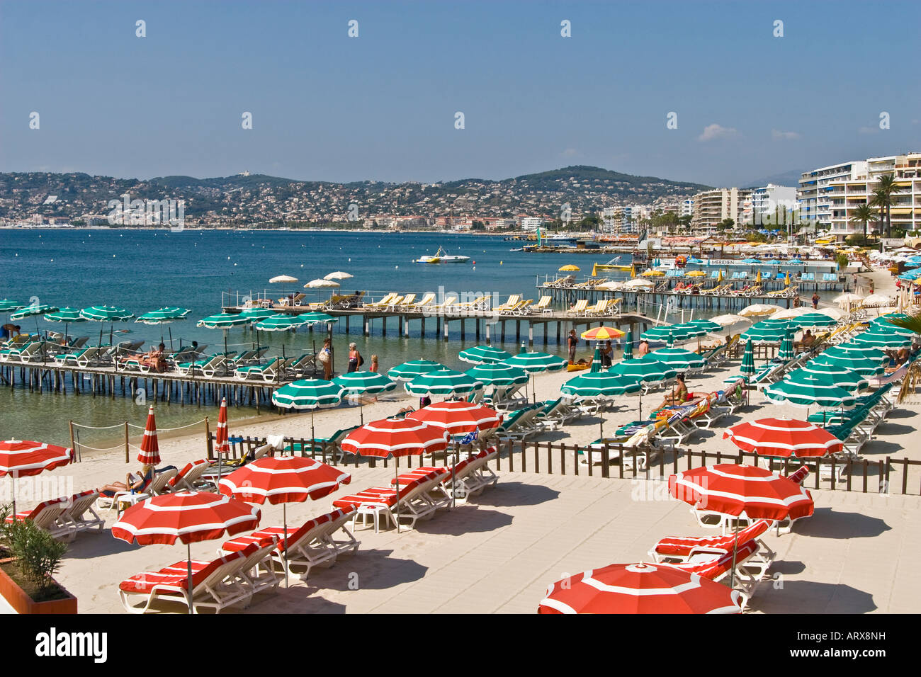 Colorful umbrellas on French Riviera beaches Juan les Pins near Antibes Stock Photo