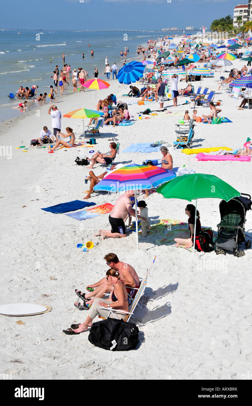 Visitors to Fort Myers Beach Florida enjoy sun and water Stock Photo