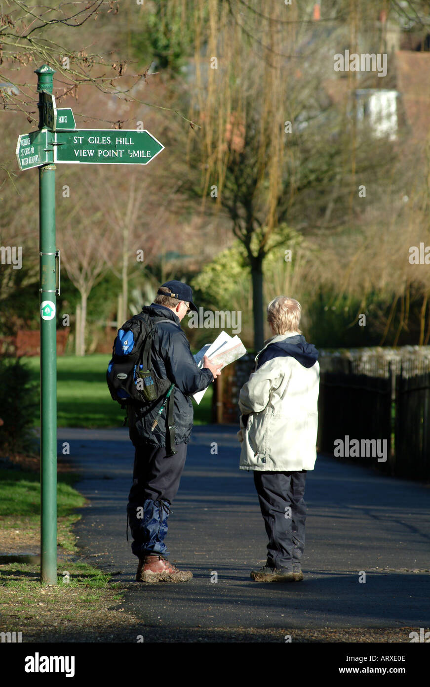 Hikers in Winchester Hampshire southern England UK walkers and signpost