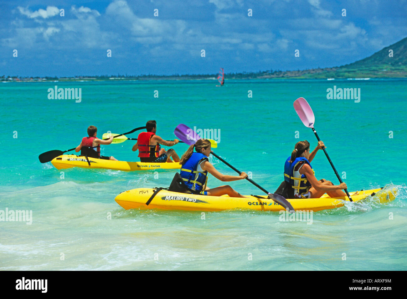 Family kayaking offshore at Kailua Beach Beach on the windward side of