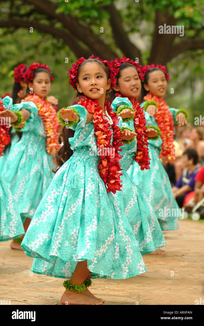 Keiki hula dancers from Halau Hula O Hokulani dancing at the Kapiolani park on Lei Day. Stock Photo