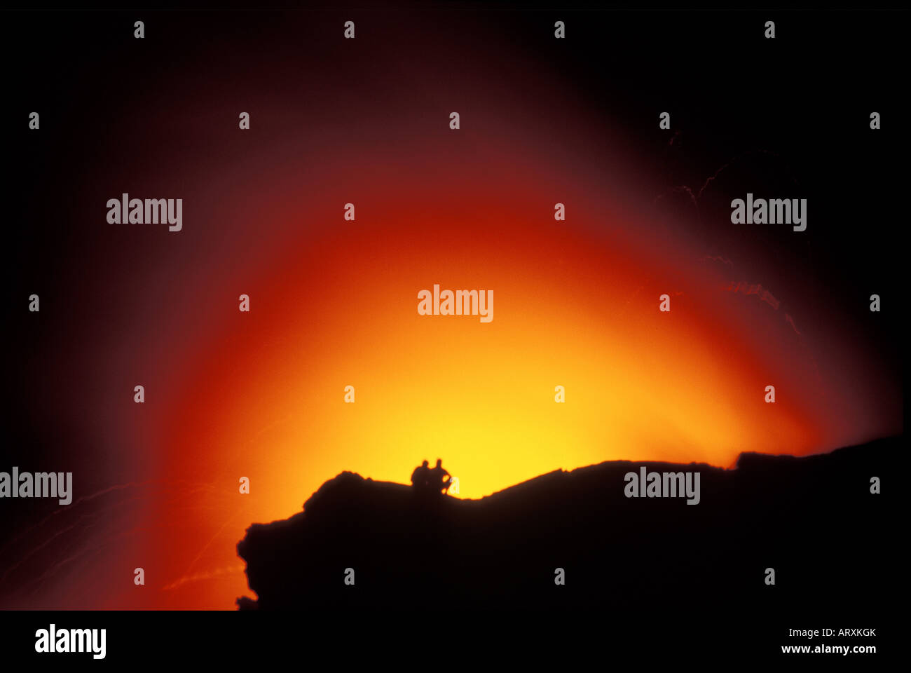 Spectators on cliff watch as Kilauea volcano flows into the Pacific