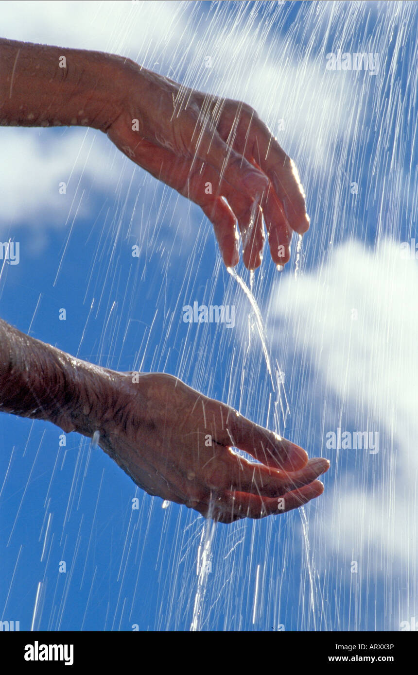 Hands with water flow Stock Photo