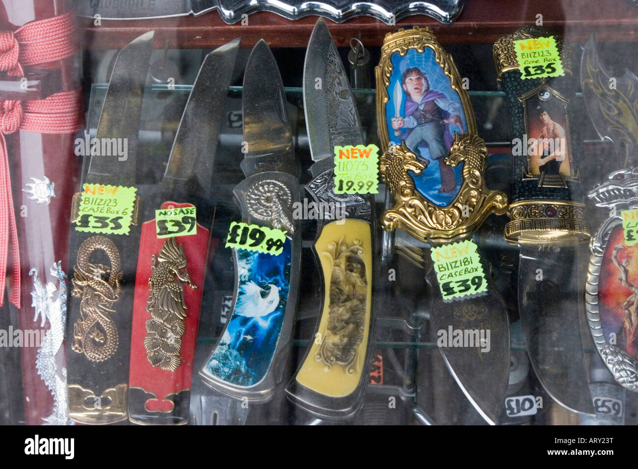 Decorated knives for sale in a shop window display Stock Photo