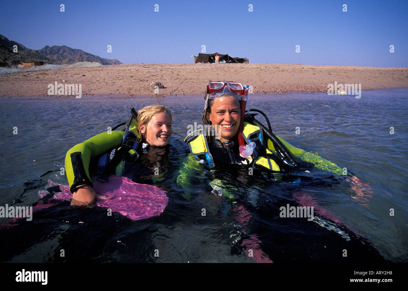 Egypt Sinai desert women diving in the Gulf of Acaba Stock Photo