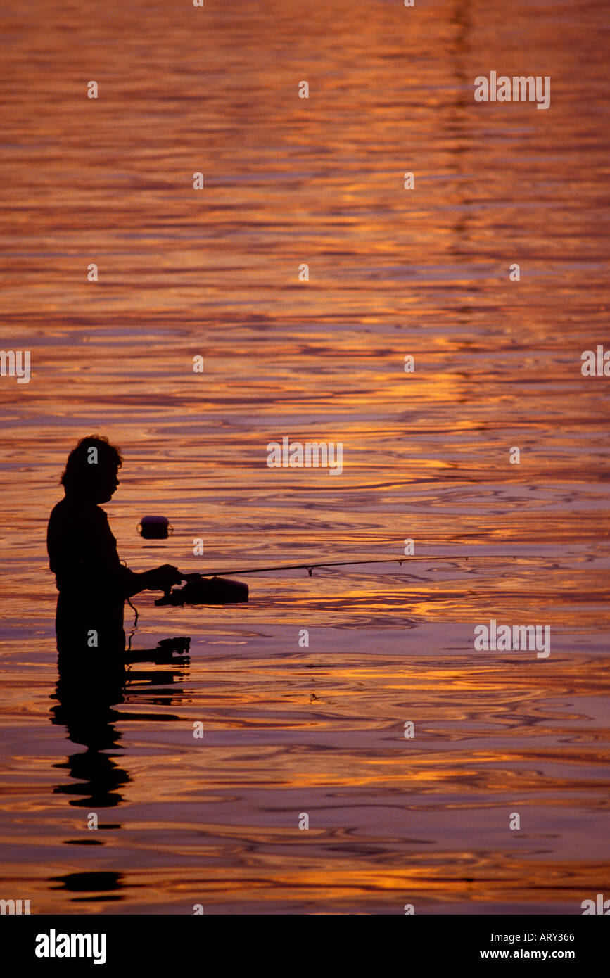 Fisherman at sunset Sarasota Florida Stock Photo