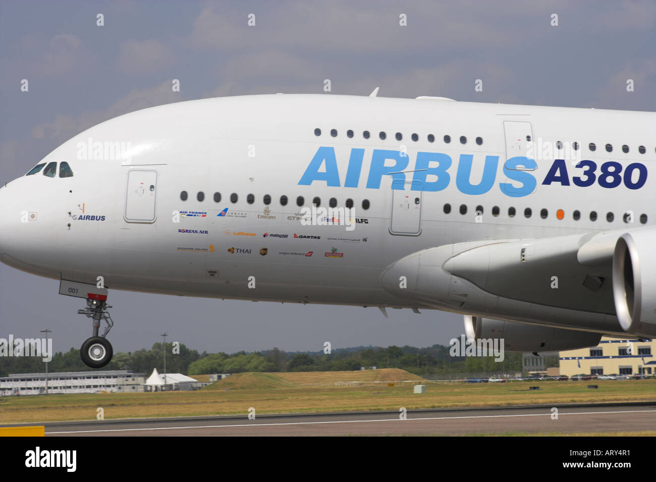 Forward fuselage and nosewheel of Airbus A380 during touchdown Stock Photo