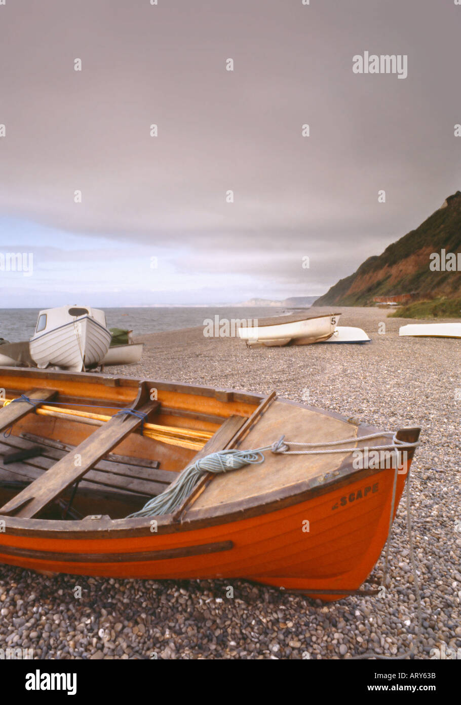 fishing boats Beer village pebble beach overcast Stock Photo - Alamy