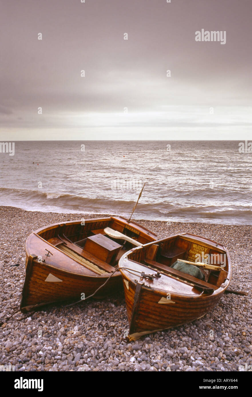 fishing boats Beer village pebble beach overcast Stock Photo - Alamy