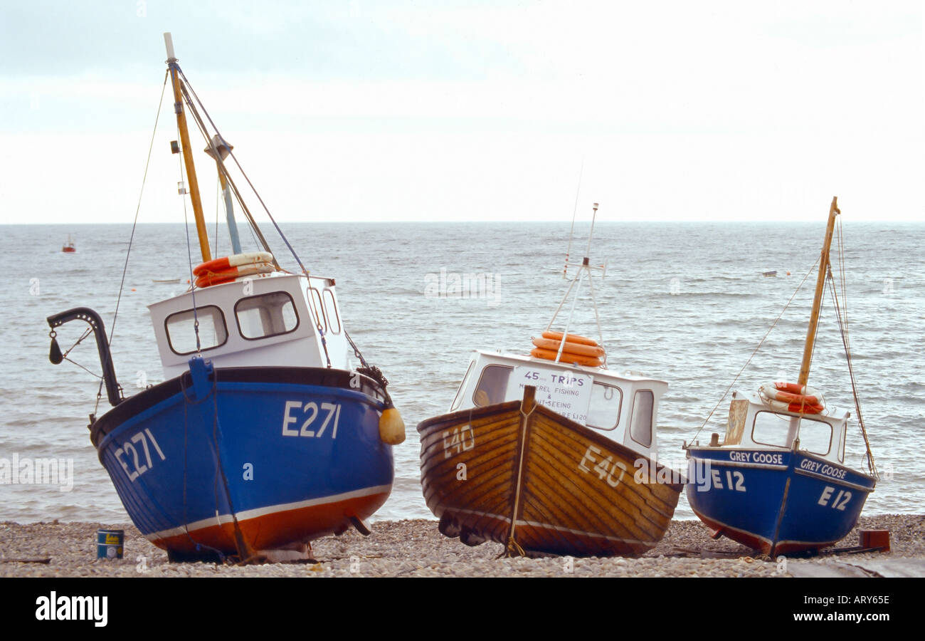 fishing boats Beer village pebble beach overcast Stock Photo - Alamy
