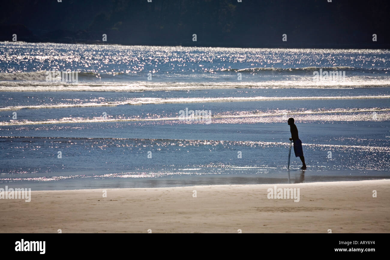 Man with skimboard Long Beach Pacific Rim national park reserve Vancouver island Canada Stock Photo