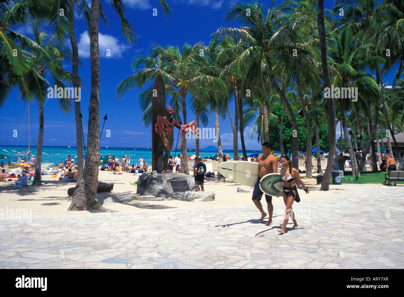The statue of Hawaiian surfing legend Duke Kahanamoku stands in tribute along Kalakaua Ave near Waikiki Beach. Stock Photo
