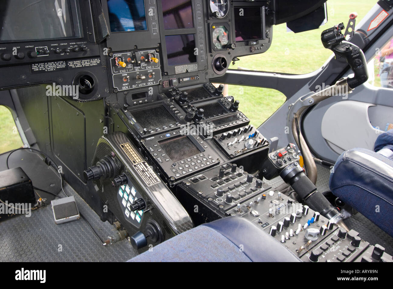 Cockpit controls and flight deck instruments in front of police helicopter Stock Photo