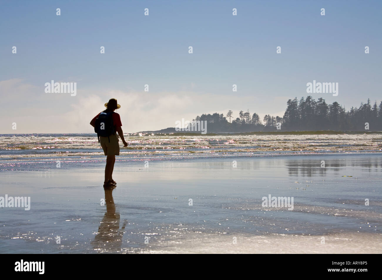 Woman walking on beach Long Beach Pacific Rim national park reserve Vancouver island Canada Stock Photo
