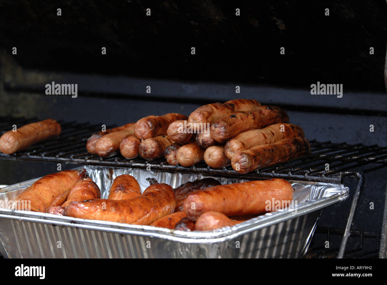 BBQ Sausages of a rack just waiting to be eaten Stock Photo Alamy