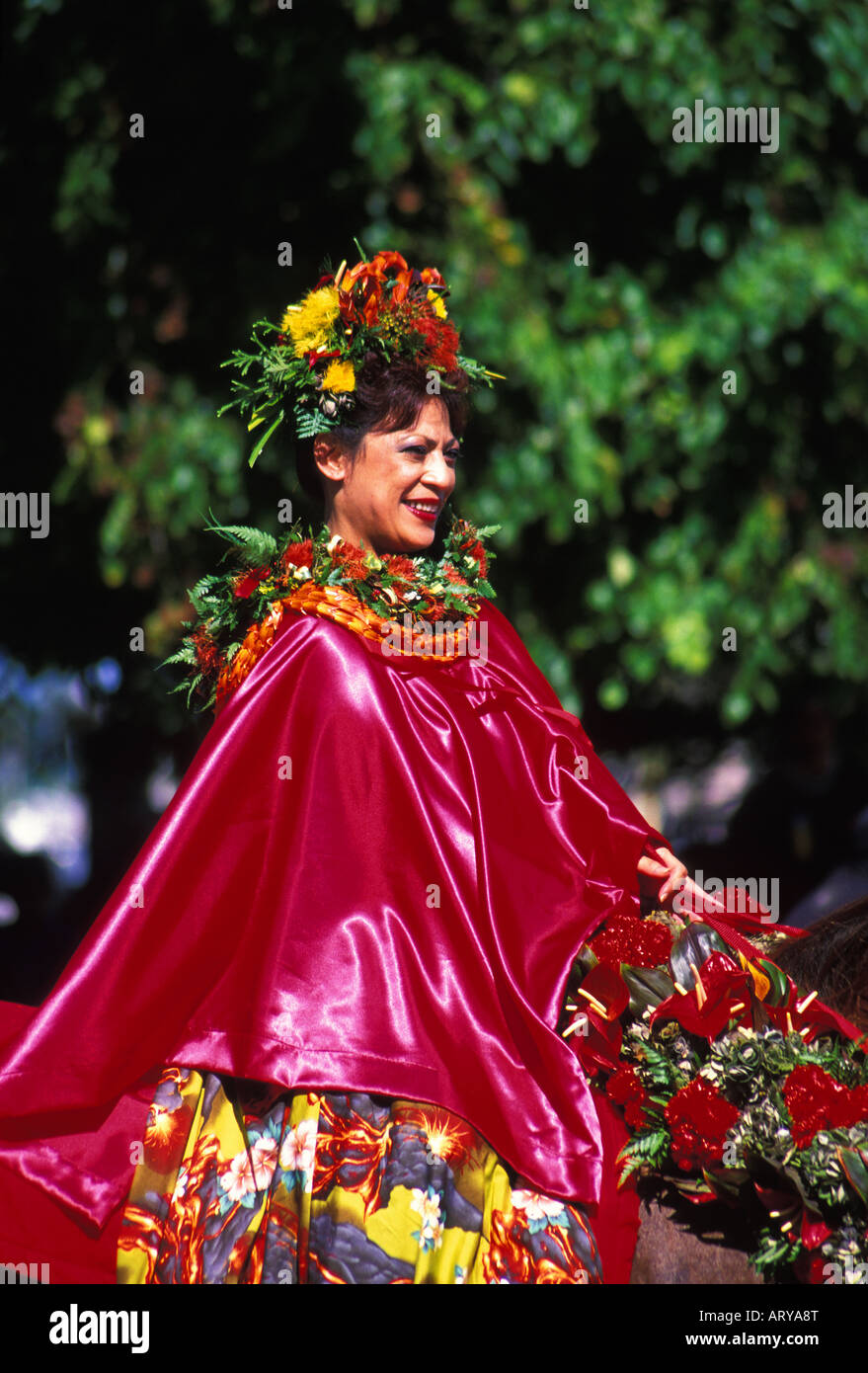 Woman with leis as a pau rider on a horse at the annual aloha week parade Stock Photo