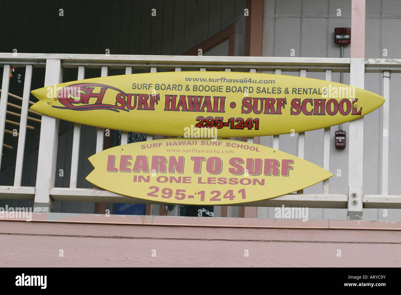 Learn to surf the north shore waves at a legitimate surfing school. This school located at the North Shore Marketplace in the Stock Photo
