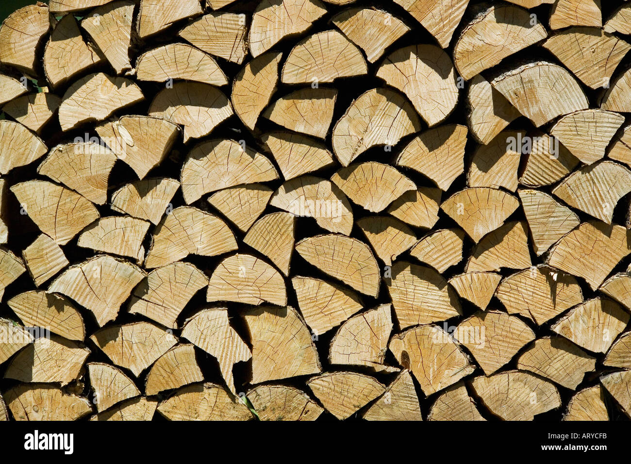 Ends of stacked split firewood Stock Photo - Alamy