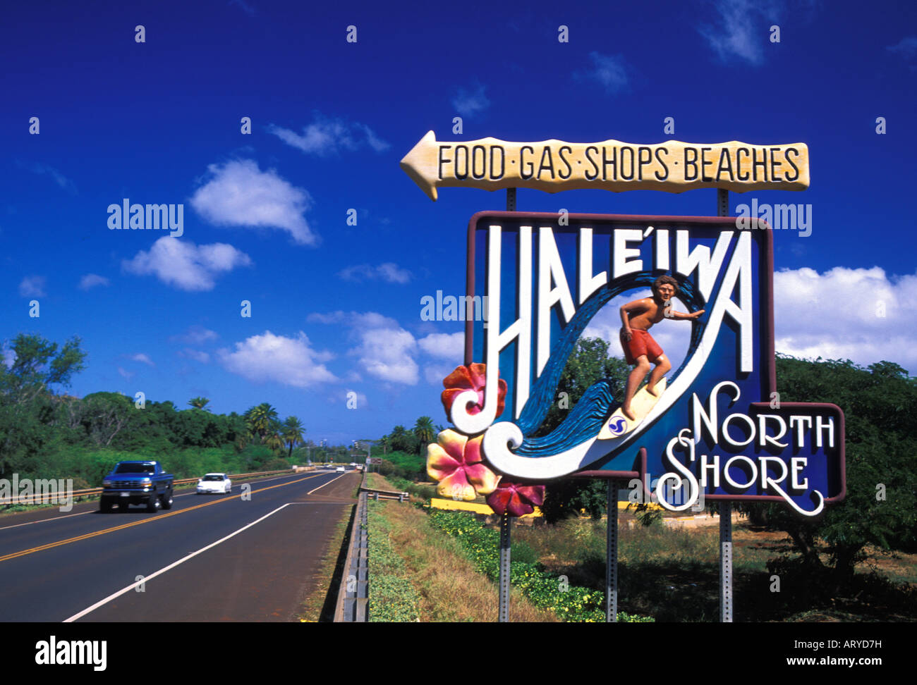 This colorful sign welcomes vacationing drivers to stop in and enjoy the sights, sounds and shopping available in the quaint Stock Photo