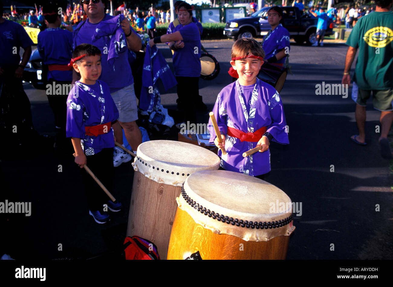 Children with japanese drums participate in a parade for the annual