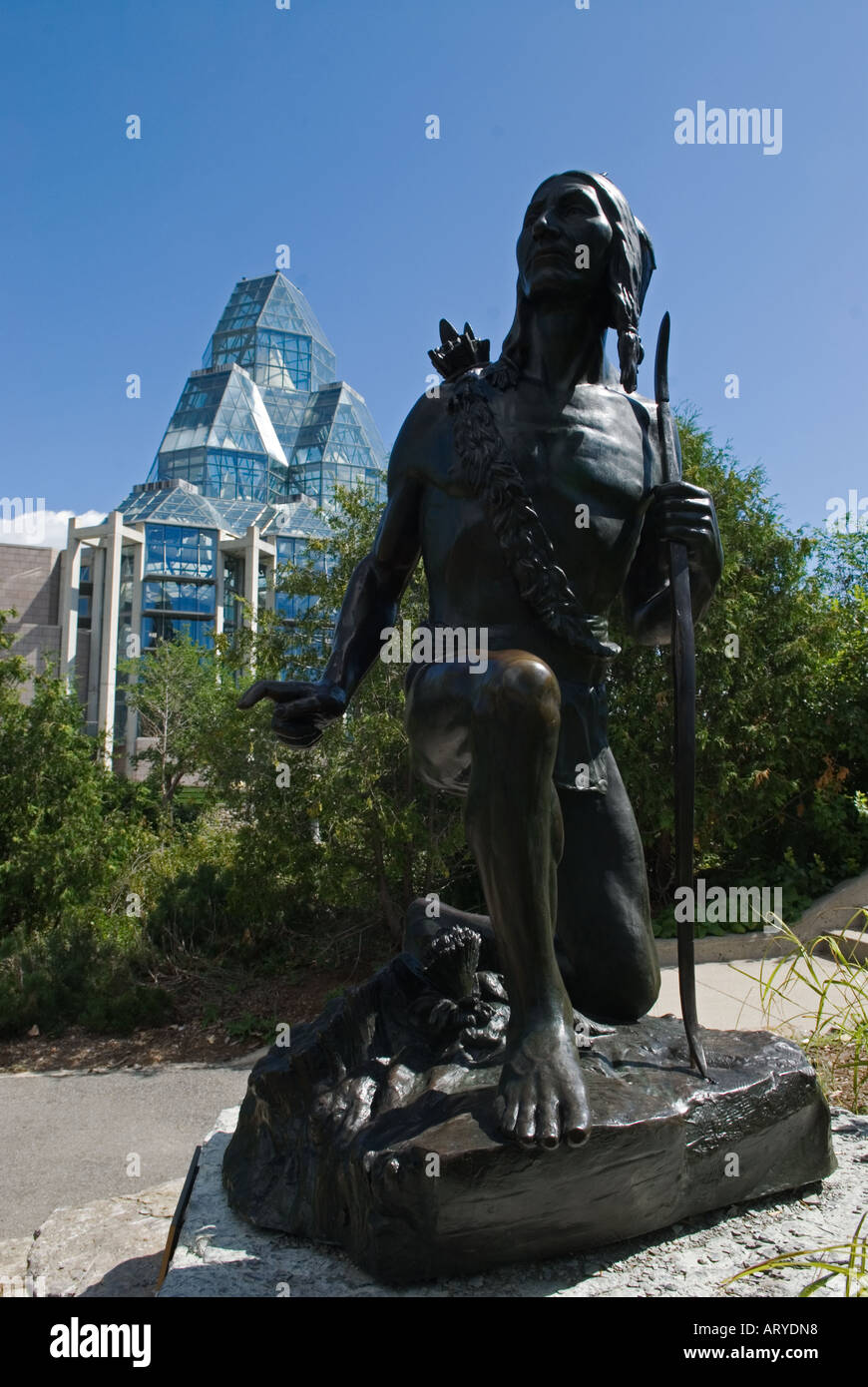 Statue of an Iroquois Indian Ottawa Ontario Canada with National Art Gallery in the background