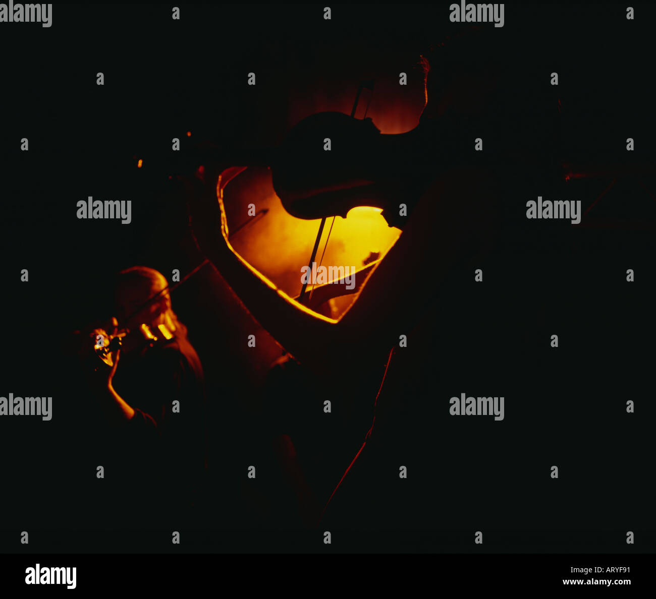 Silhouette woman playing violin hi-res stock photography and images - Alamy