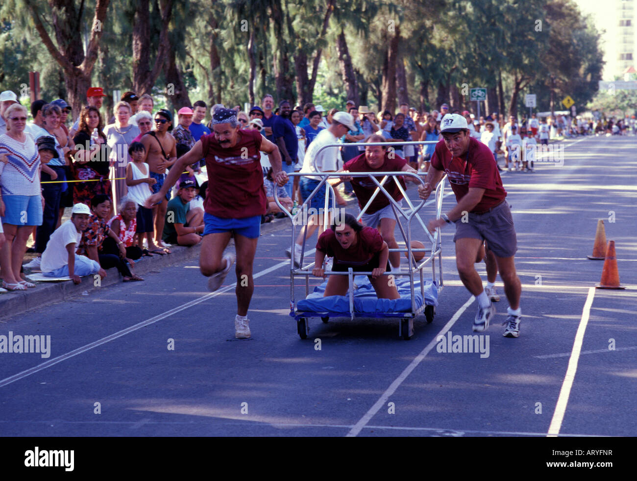 Participants at the Honolulu International Bed Race with spectators ...