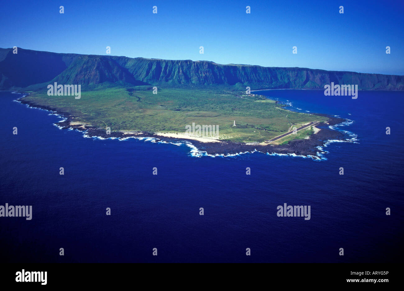 Aerial view of the northeast side of the Kalaupapa peninsula, showing the lighthouse in the center, and the topside of Molokai Stock Photo