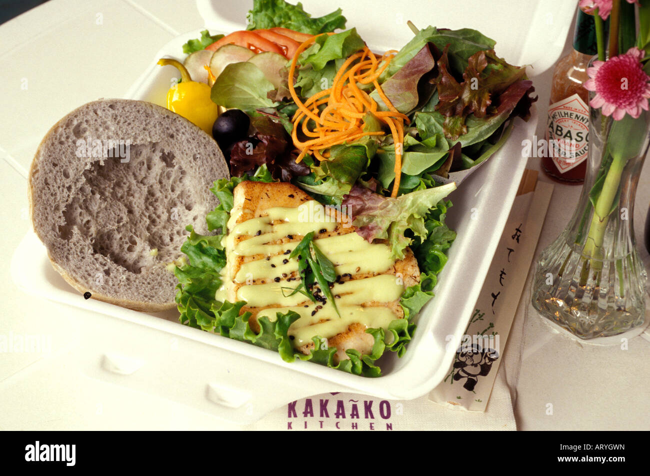 Local plate lunch with a fish sandwich on taro bun, from Kakaako