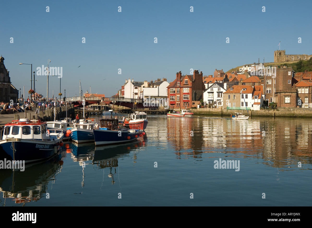 Fishing boats in Whitby Harbour in summer North Yorkshire England UK ...