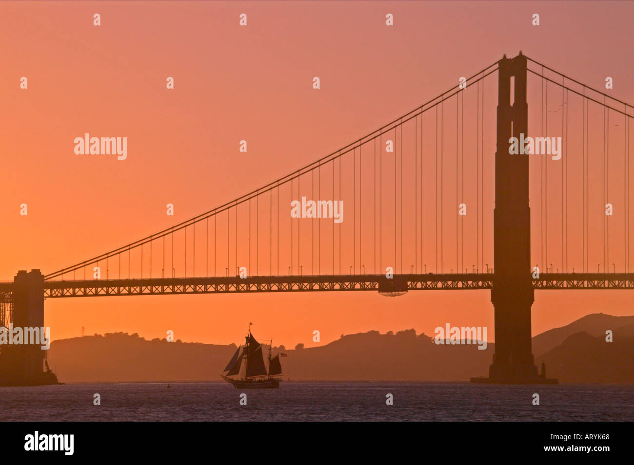 San Francisco Golden Gate bridge sunset transportation California Sailboat evening scenic attractive Stock Photo