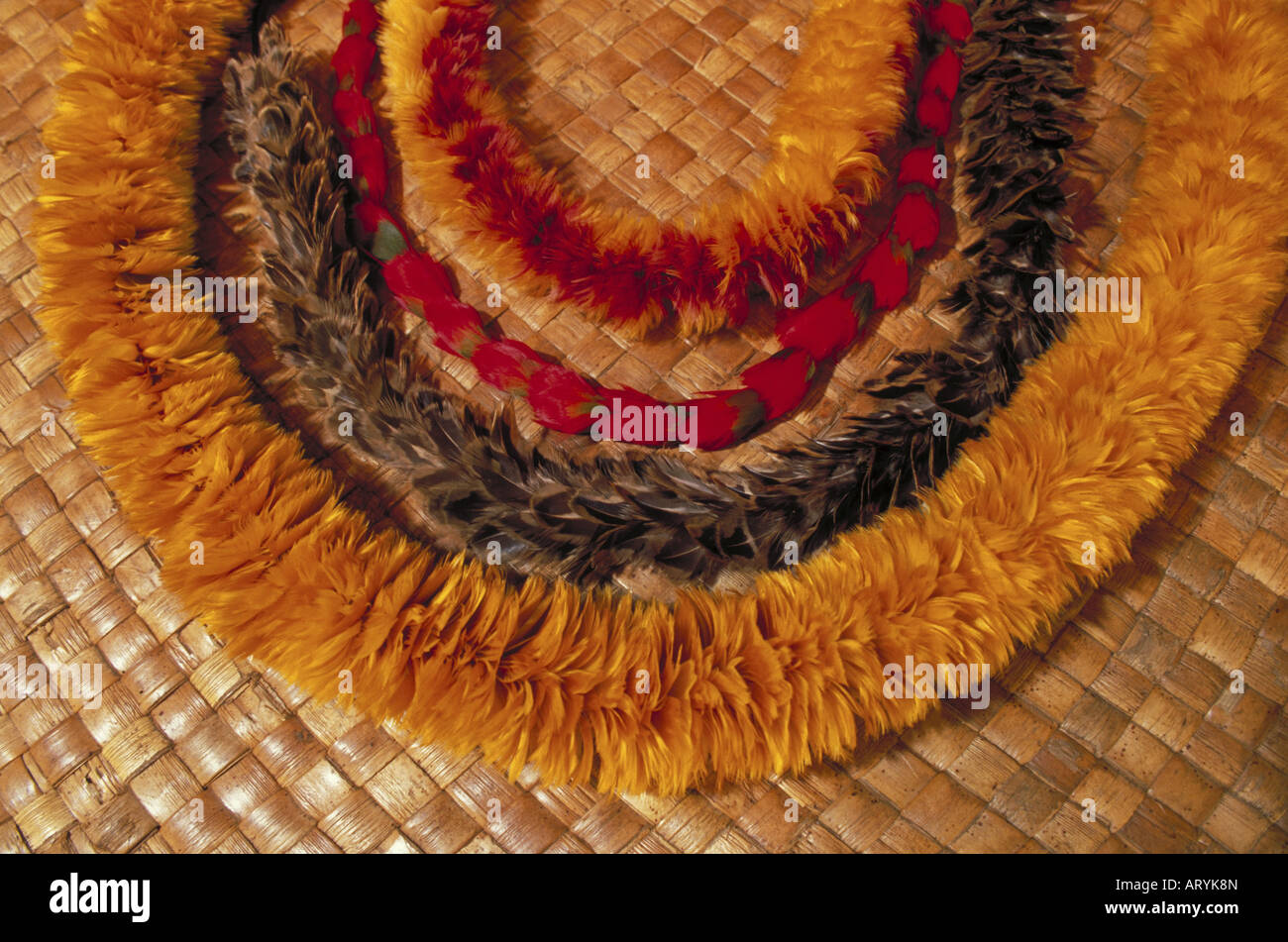 Feather leis on lauhala mat Stock Photo