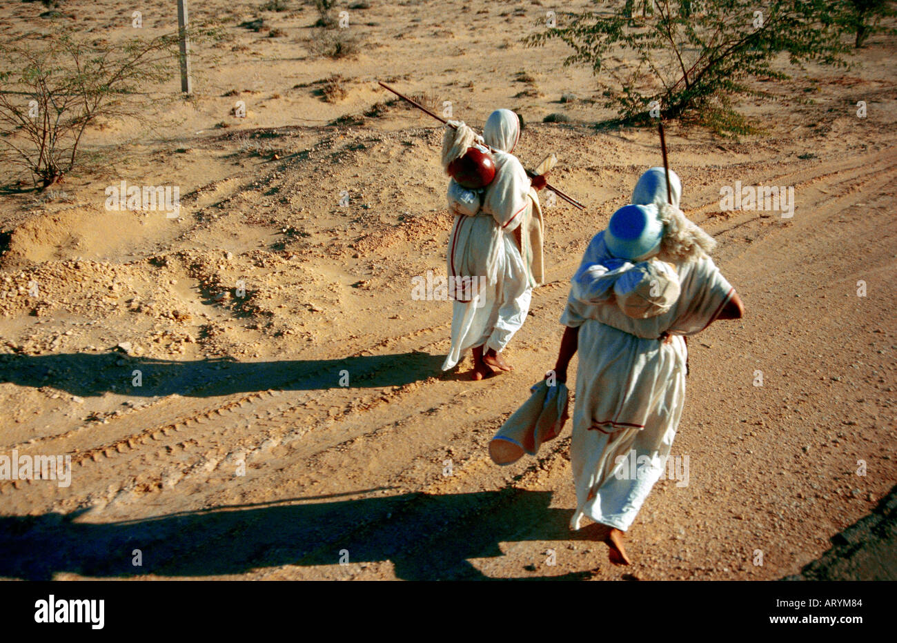 Rajasthan India Jain Nuns In Desert Carrying All Possessions Stock Photo