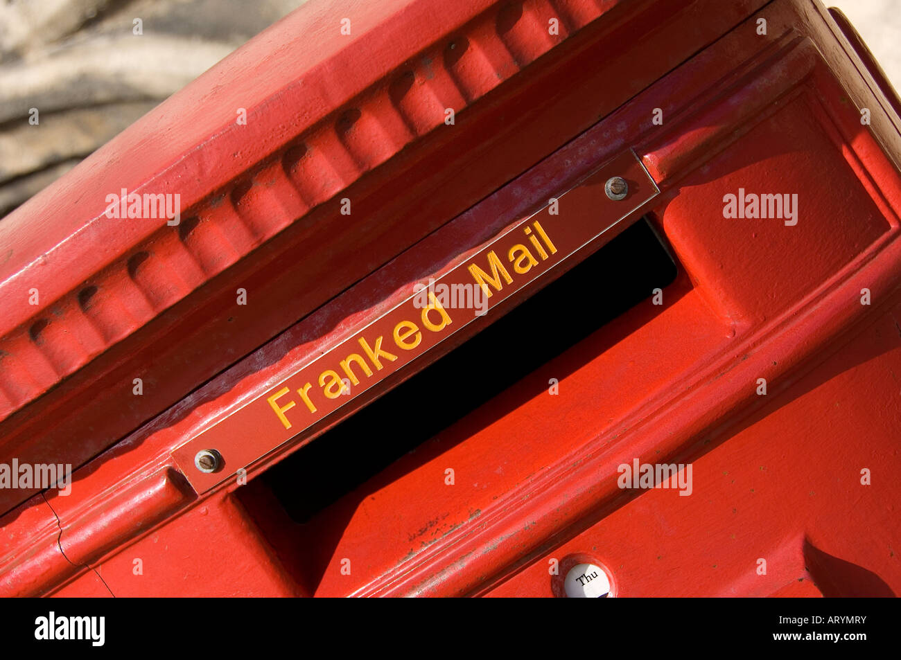 Close up of red franked mail letter box letterbox postbox England UK United Kingdom GB Great