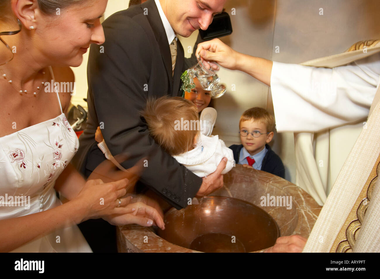 Infant baptism priest hires stock photography and images Alamy
