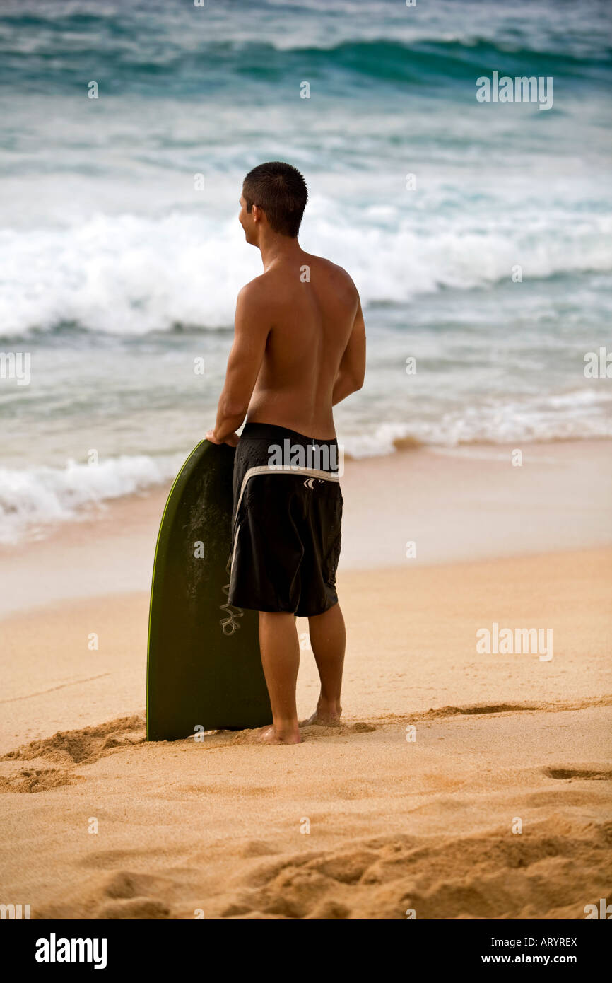 Hawaiian young man on beach Stock Photo