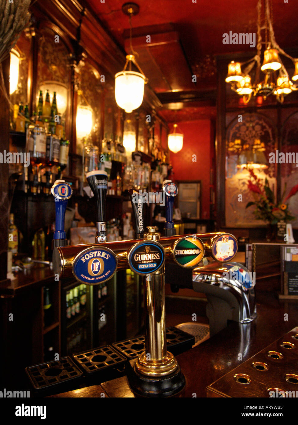 Beer tap with four different brands of beer in typical British pub interior the Salisbury London UK Stock Photo