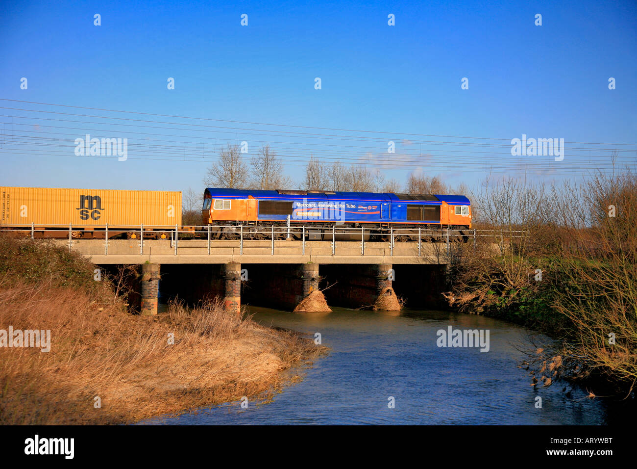 66718 Metronet Gwyneth Dunwoody diesel train crossing river Welland Lolham Peterborough Cambridgeshire England Britain UK Stock Photo