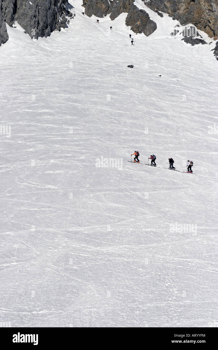 Mountaineers traversing a snow field Stock Photo