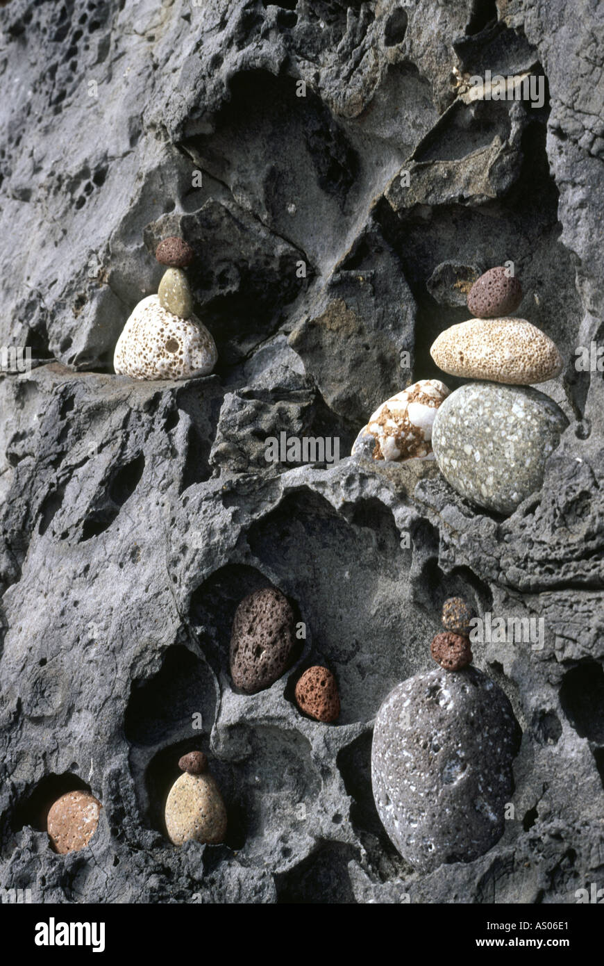 stones balanced in rock caves in Sardinia Stock Photo