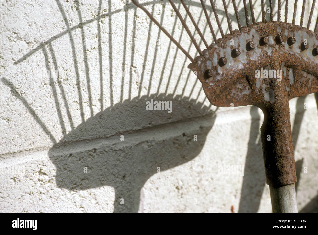 Rake against wall hi-res stock photography and images - Alamy