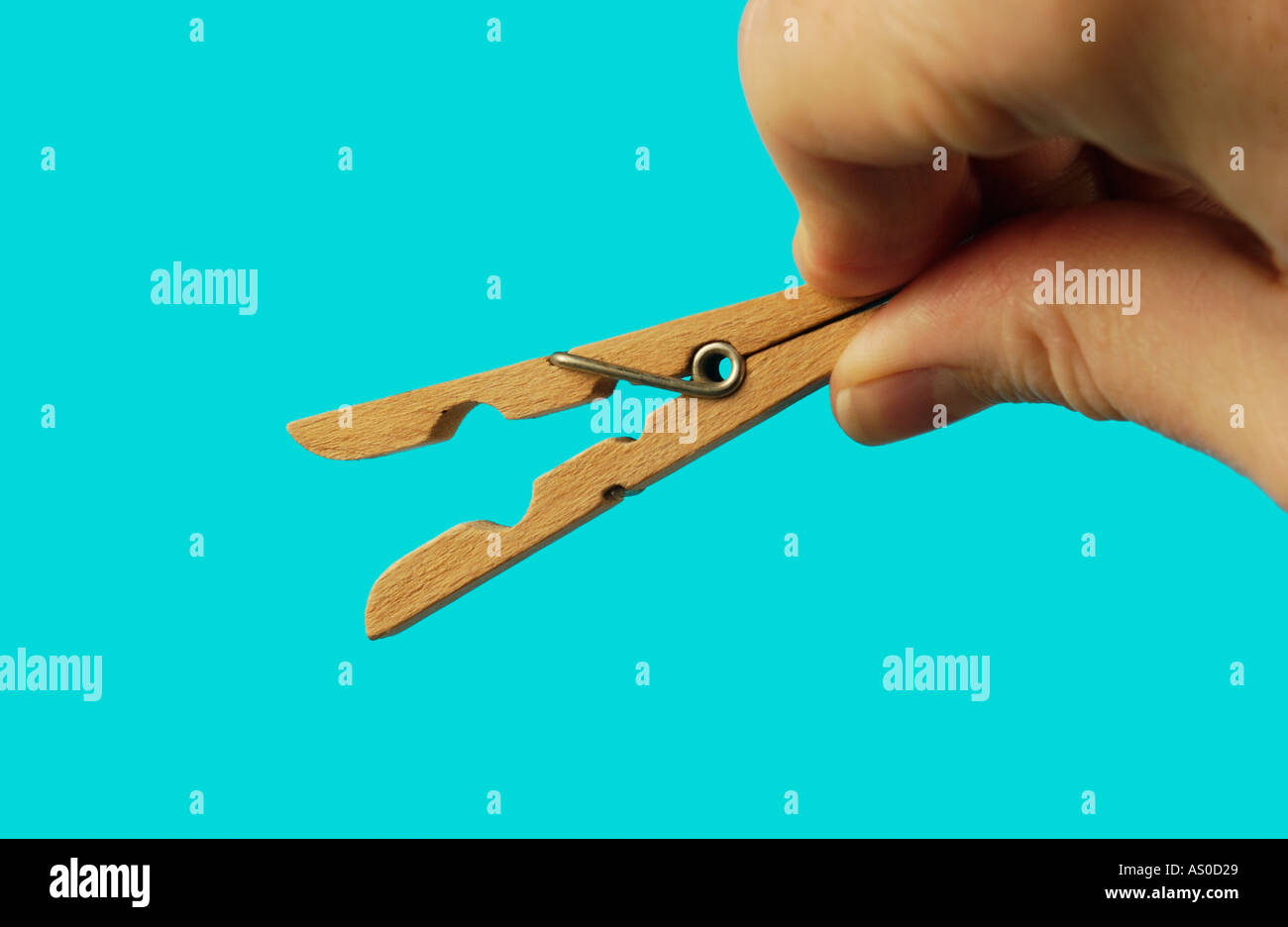 hand with clothes peg Stock Photo Alamy