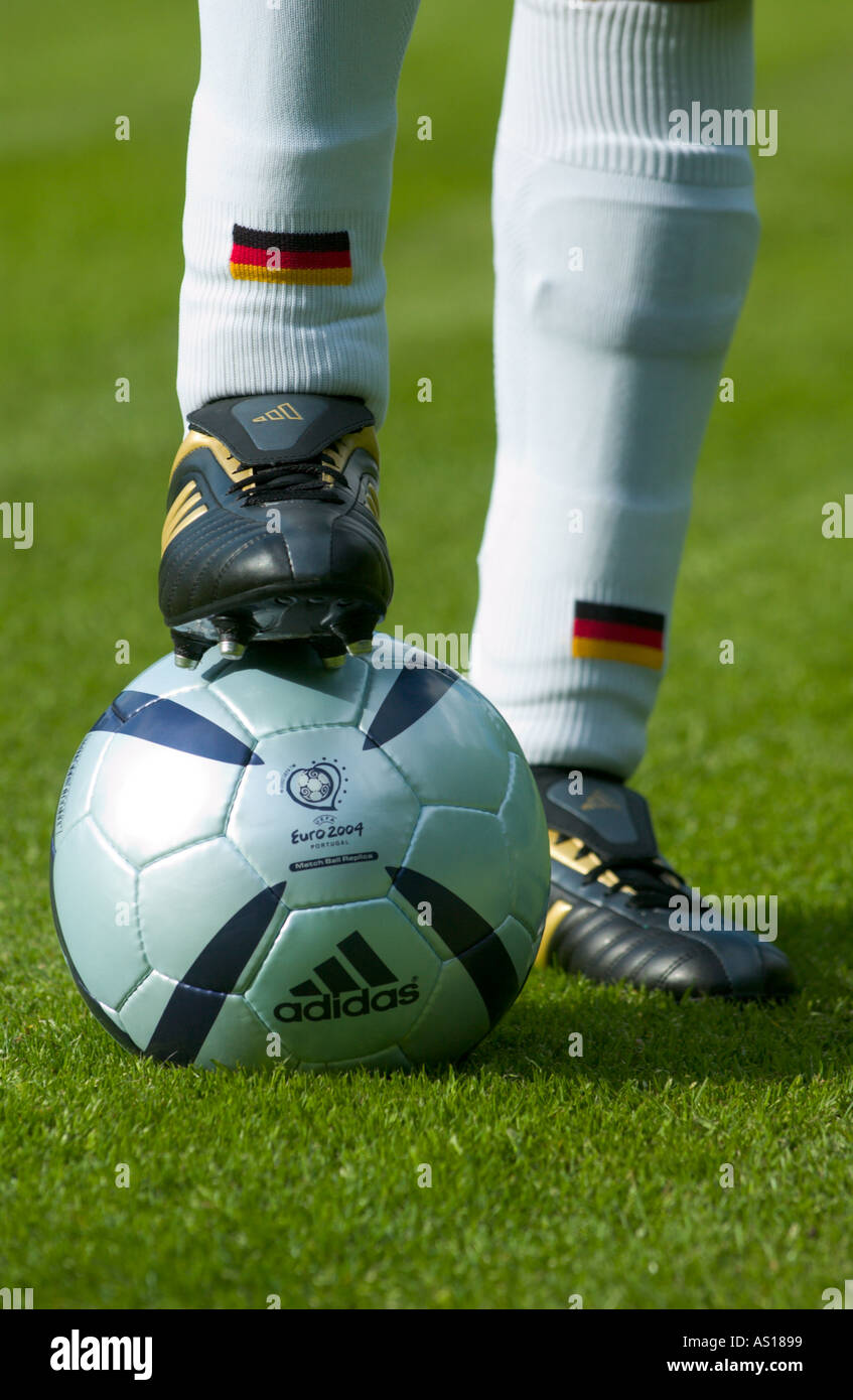 german soccer player resting his foot on the Ball of the Euro 2004