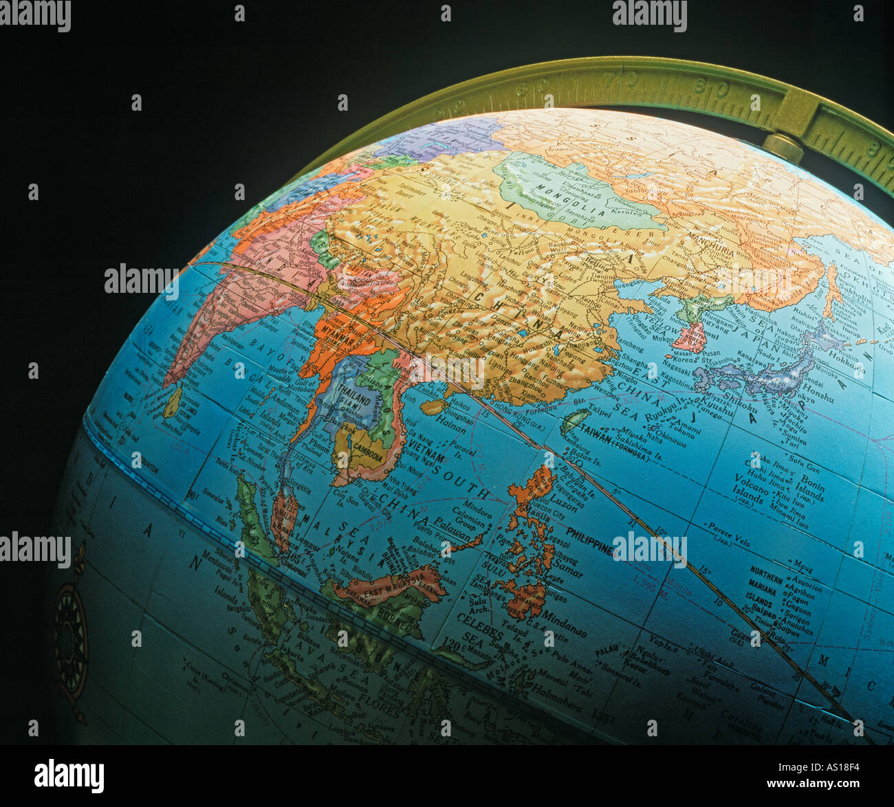 Globe showing Asia And the far east silhouetted on black background Stock Photo