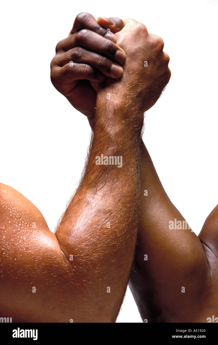 African American and Caucasian Competing Arm wrestlers shot on a white background Stock Photo