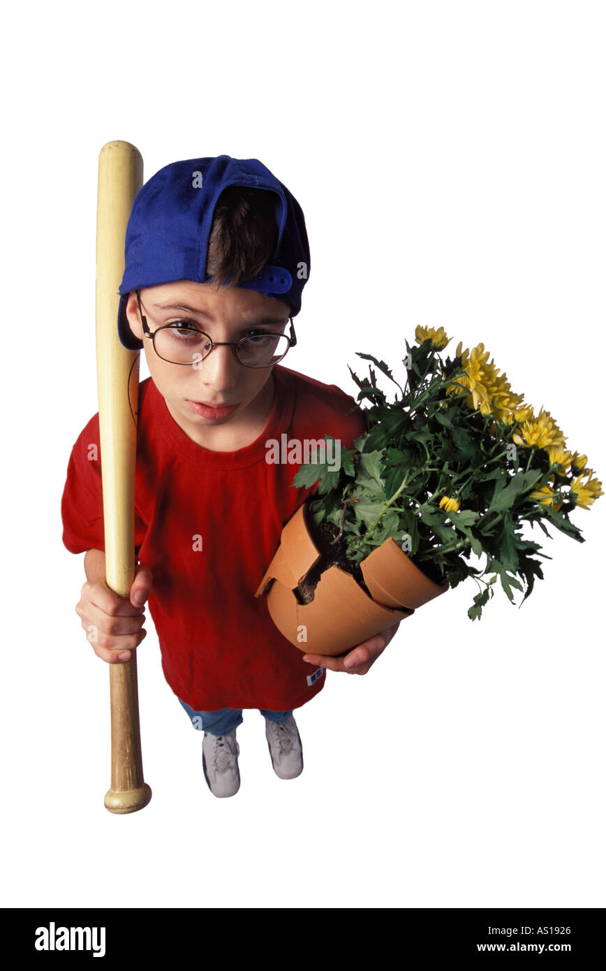 Fisheye shot of nerdy boy with baseball bat and broken flowerpot asking for forgiveness on a white background Stock Photo