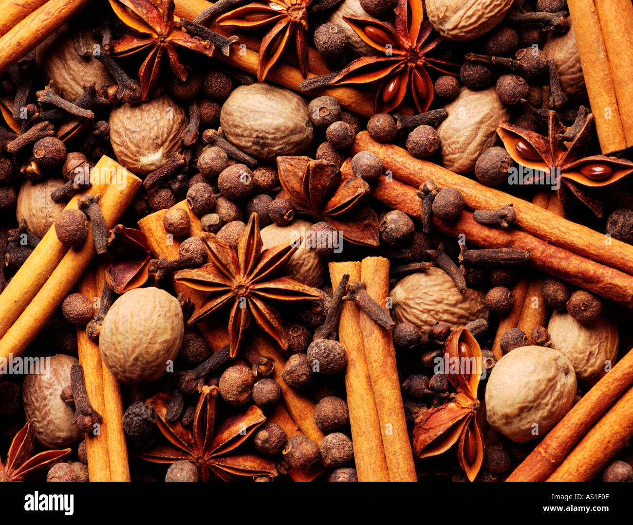 Cinnamon clove anise star nutmeg and allspice background Stock Photo