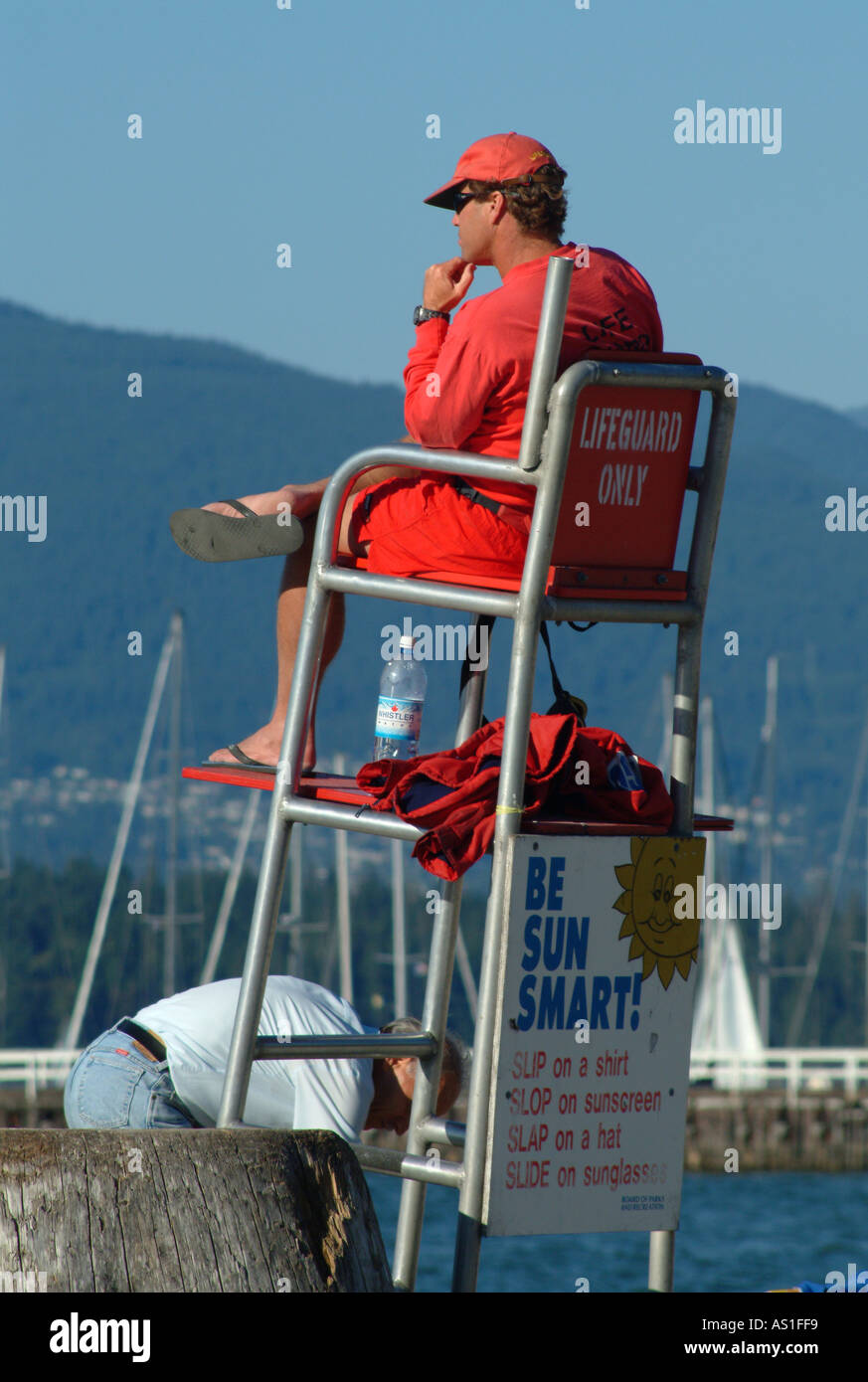 Lifeguard surveying beach in Vancouver BC Stock Photo Alamy